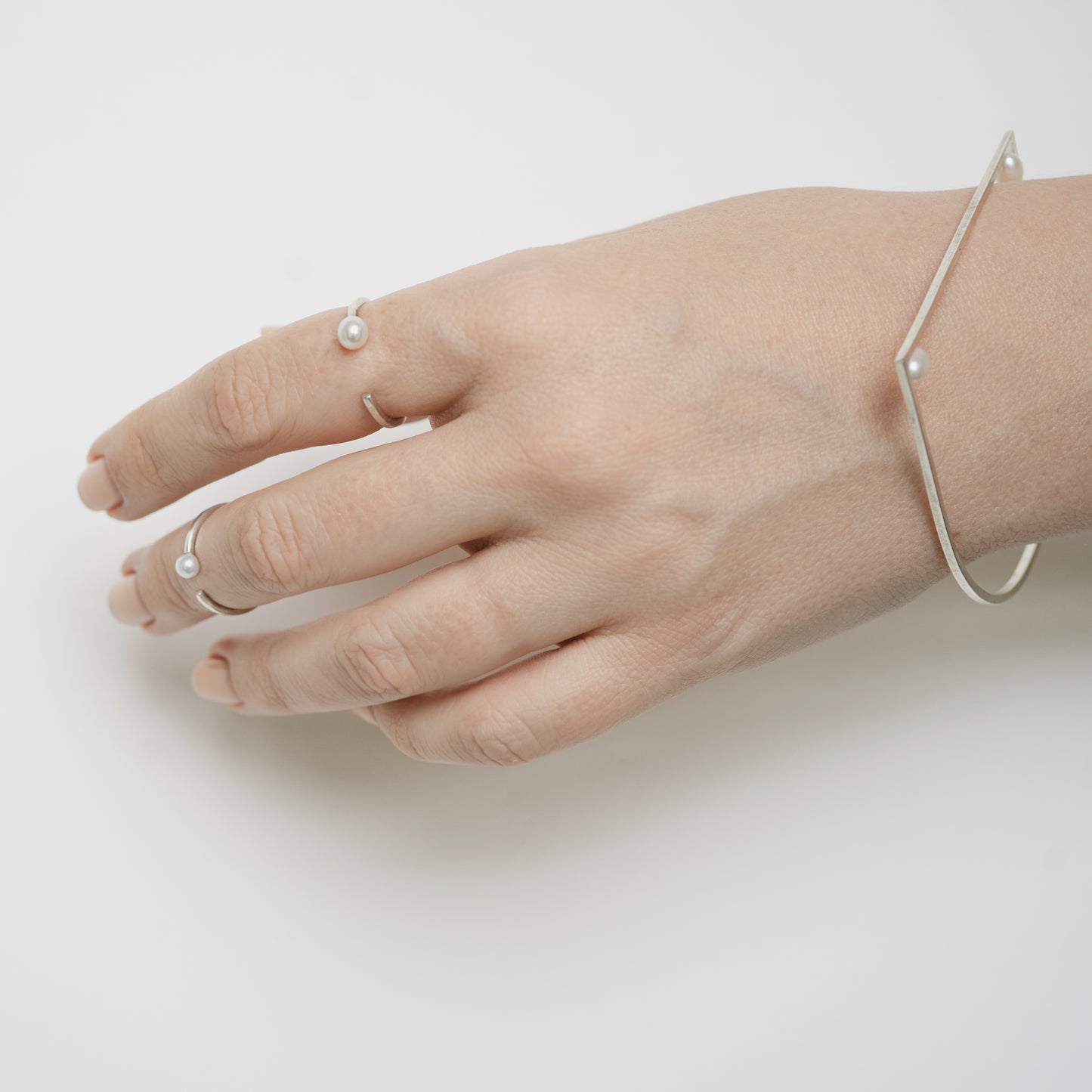 A person showcasing the elegant Comet Ring, demonstrating its understated sophistication and perfect fit for everyday wear.