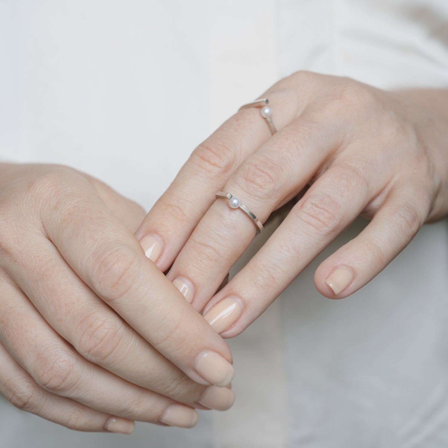 A person showcasing the elegant open band ring, demonstrating its understated sophistication and perfect fit for everyday wear.