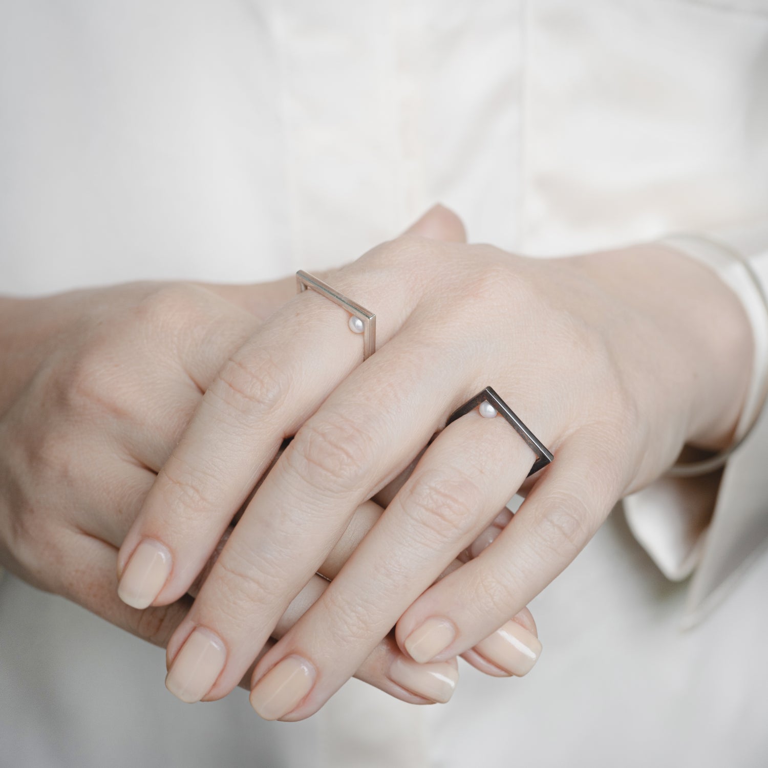 Model Wearing Tangent Ring: A person showcasing the Tangent Ring, demonstrating its minimalist sophistication and perfect fit for everyday wear.